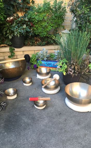 Multiple therapeutic singing bowls
